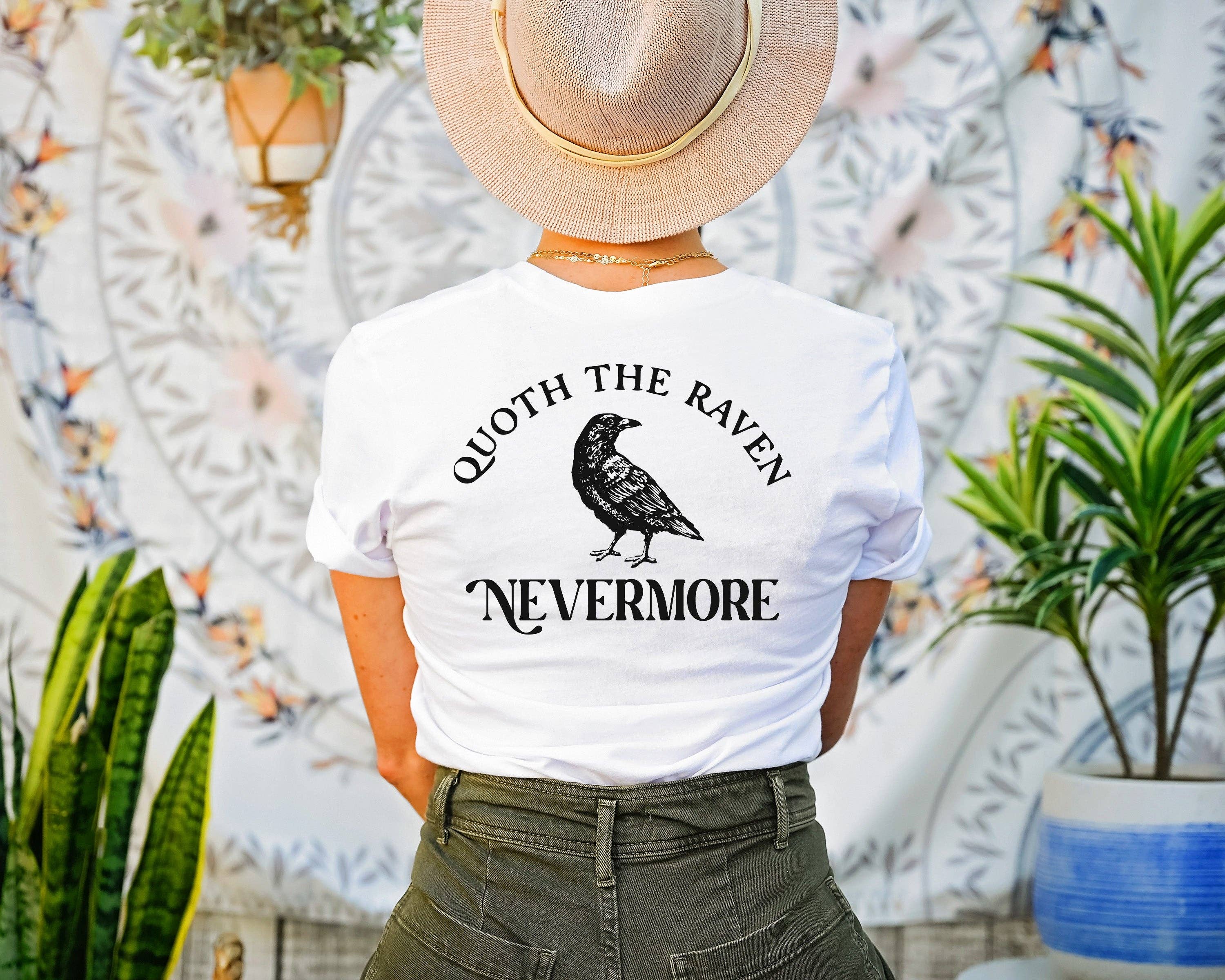 White t-shirt with a pocket size Edgar Allen Poe on the front, left and Quoth the Raven Nevermore centered on back with an image of a raven.
