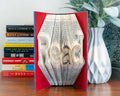 Do it yourself fold book that spells read, dream or home once all the pages are folded.