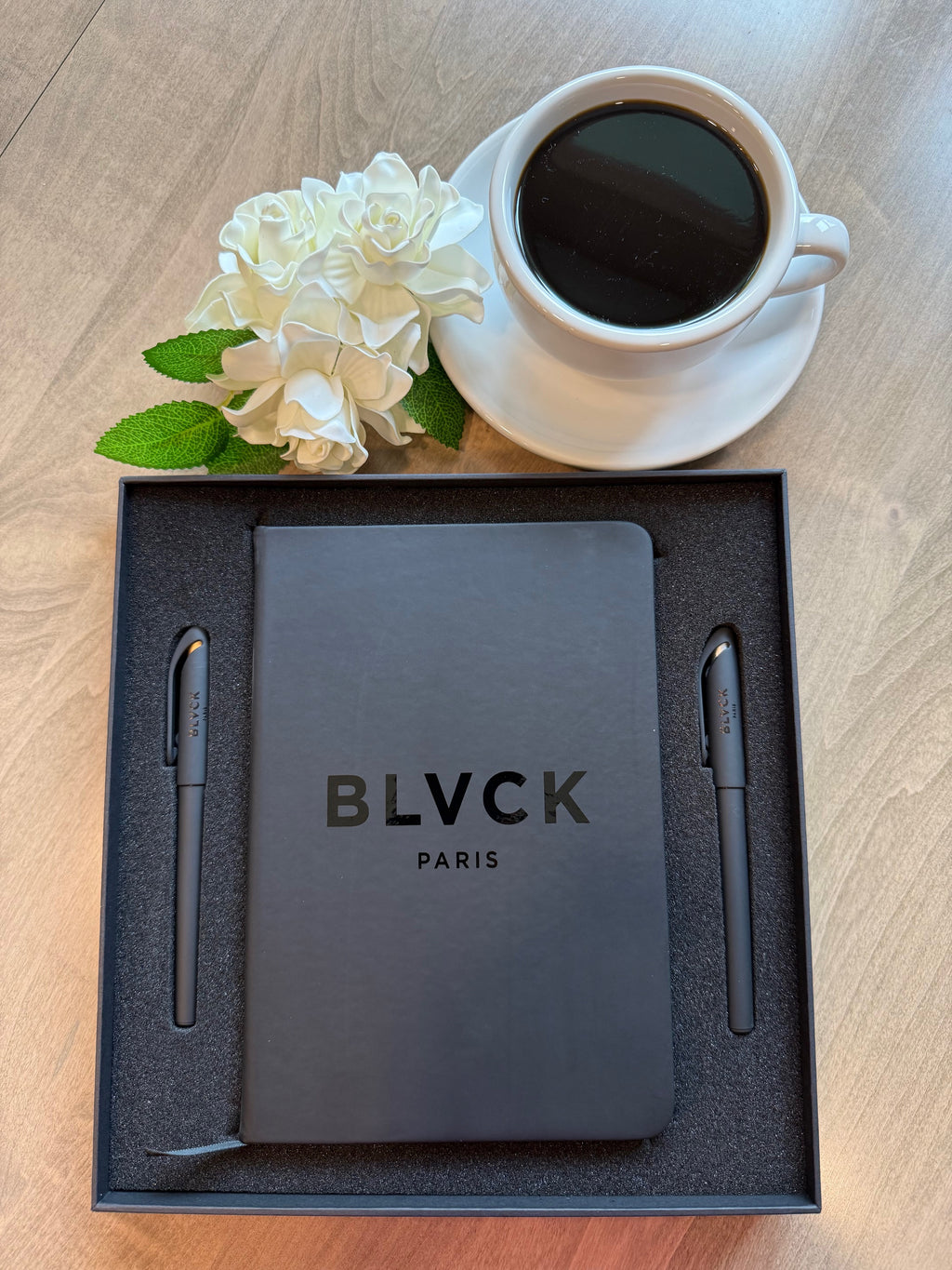 Black smooth cover writing journal with all black pages made for white or colorful gel ink.